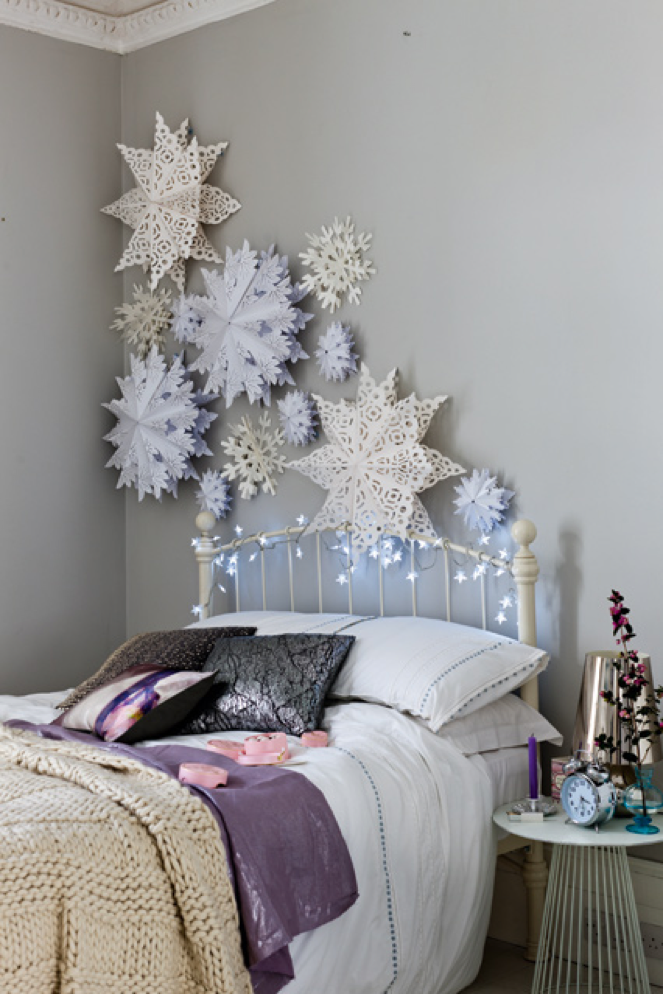 Fancy Paper Snowflakes Attached To A Bedroom Wall